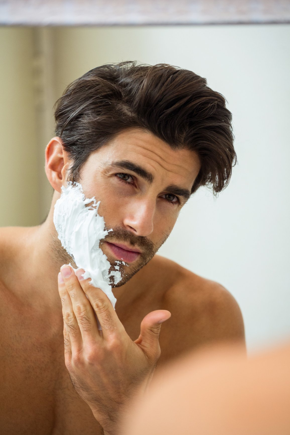 Man applying shaving foam